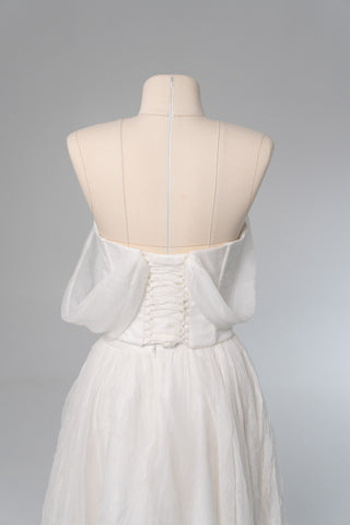 Natural silk set with asymmetrical elements — a corset with dropped sleeves and a skirt with different length options