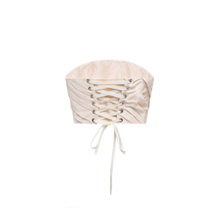 A gold set consisting of a corset and a skirt with a removable train, designed for special occasions and an accentuated silhouette