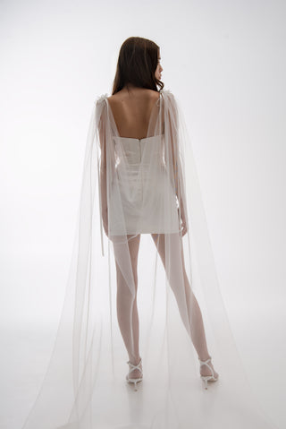 Lightweight cape made of tulle with floral accents and elongated trains