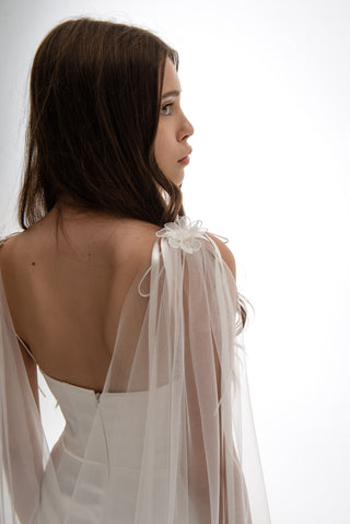 Lightweight cape made of tulle with floral accents and elongated trains