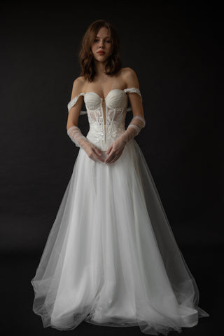 Exquisite transparent tulle gloves that add lightness, tenderness, and refined romance to your look