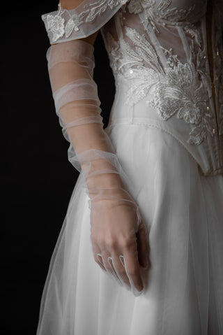 Exquisite transparent tulle gloves that add lightness, tenderness, and refined romance to your look