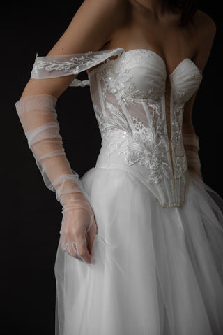 Exquisite transparent tulle gloves that add lightness, tenderness, and refined romance to your look