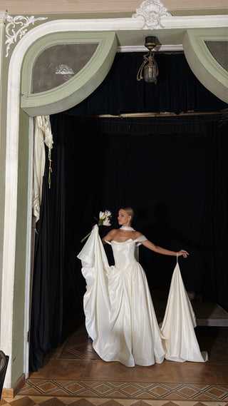 Wedding set with a lace-up corset with dropped sleeves made of chiffon and a fluffy A-line skirt with a long train and a loop for the arms