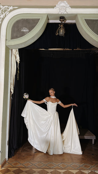 Wedding set with a lace-up corset with dropped sleeves made of chiffon and a fluffy A-line skirt with a long train and a loop for the arms