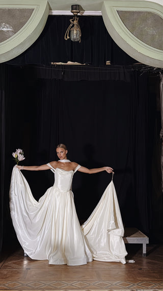 Wedding set with a lace-up corset with dropped sleeves made of chiffon and a fluffy A-line skirt with a long train and a loop for the arms