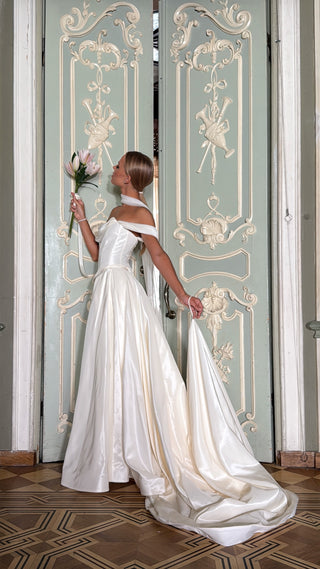 Wedding set with a lace-up corset with dropped sleeves made of chiffon and a fluffy A-line skirt with a long train and a loop for the arms