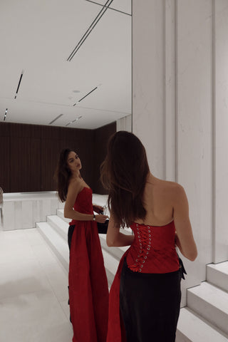 Red corset with train — a striking accent for special occasions