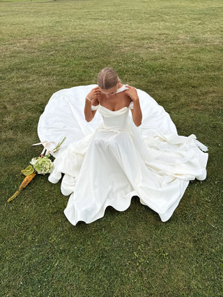 Wedding set with a lace-up corset with dropped sleeves made of chiffon and a fluffy A-line skirt with a long train and a loop for the arms