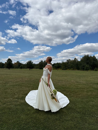 Wedding set with a lace-up corset with dropped sleeves made of chiffon and a fluffy A-line skirt with a long train and a loop for the arms