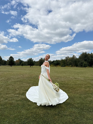 Wedding set with a lace-up corset with dropped sleeves made of chiffon and a fluffy A-line skirt with a long train and a loop for the arms