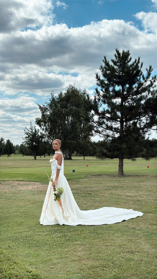 Wedding set with a lace-up corset with dropped sleeves made of chiffon and a fluffy A-line skirt with a long train and a loop for the arms