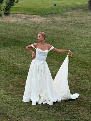 Wedding set with a lace-up corset with dropped sleeves made of chiffon and a fluffy A-line skirt with a long train and a loop for the arms