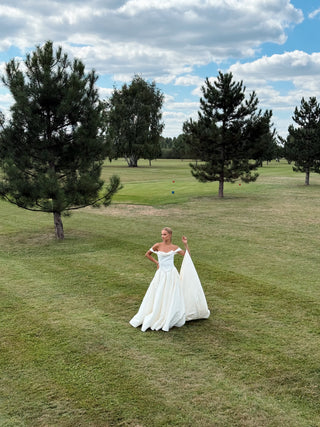 Wedding set with a lace-up corset with dropped sleeves made of chiffon and a fluffy A-line skirt with a long train and a loop for the arms