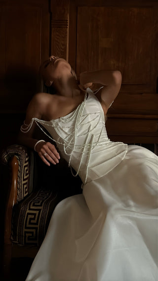 Set with a corset and skirt decorated with pearls — corset with an asymmetrical neckline, A-line skirt with a train