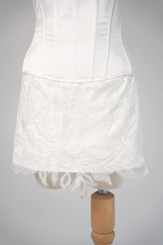 Original garment on mannequin — Plus Size Lace Bridal Corset & Appliqué Mini Skirt Set