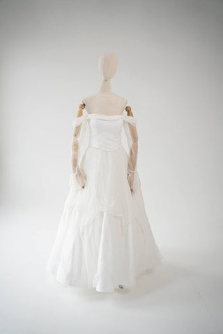 Original silk bridal set on mannequin — corset, skirt and detachable sleeves