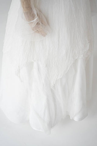 Original silk bridal set on mannequin — corset, skirt and detachable sleeves