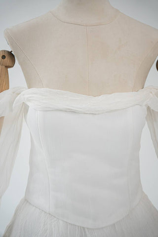 Original silk bridal set on mannequin — corset, skirt and detachable sleeves