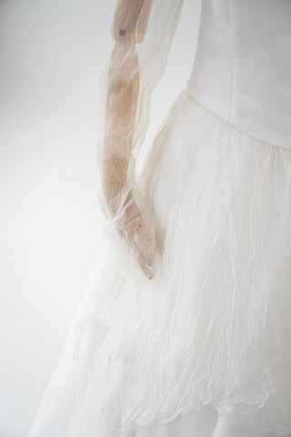 Original silk bridal set on mannequin — corset, skirt and detachable sleeves