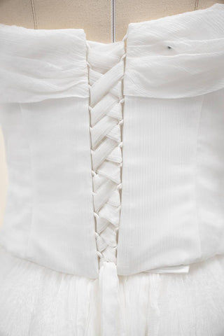 Original silk bridal set on mannequin — corset, skirt and detachable sleeves